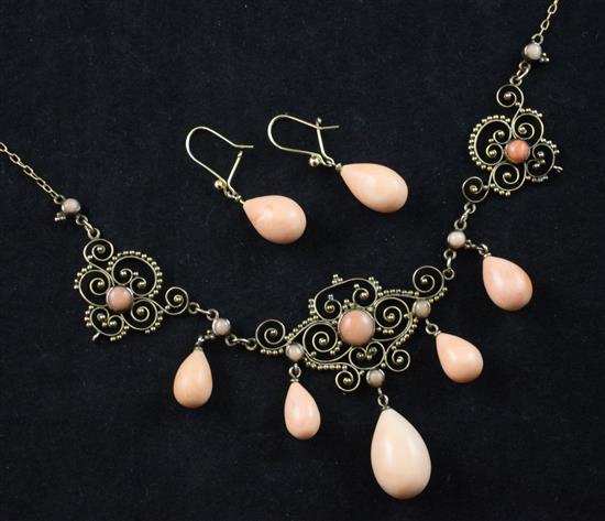 A late 19th century gold and coral drop pendant choker necklace and pair of earrings, necklace 17in.